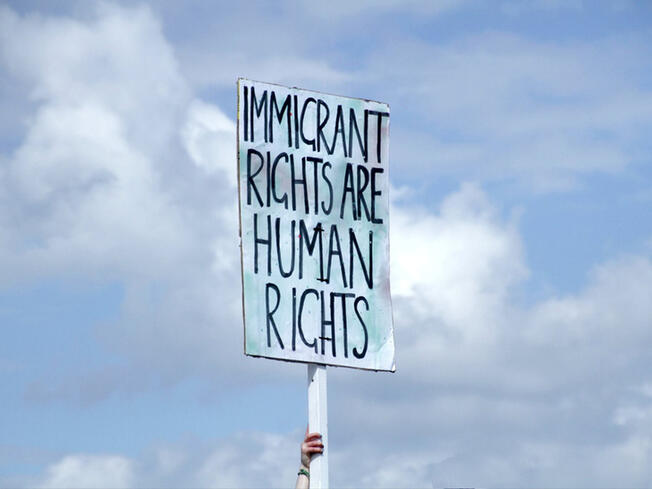 Banner saying "Immigrant rights are human rights"